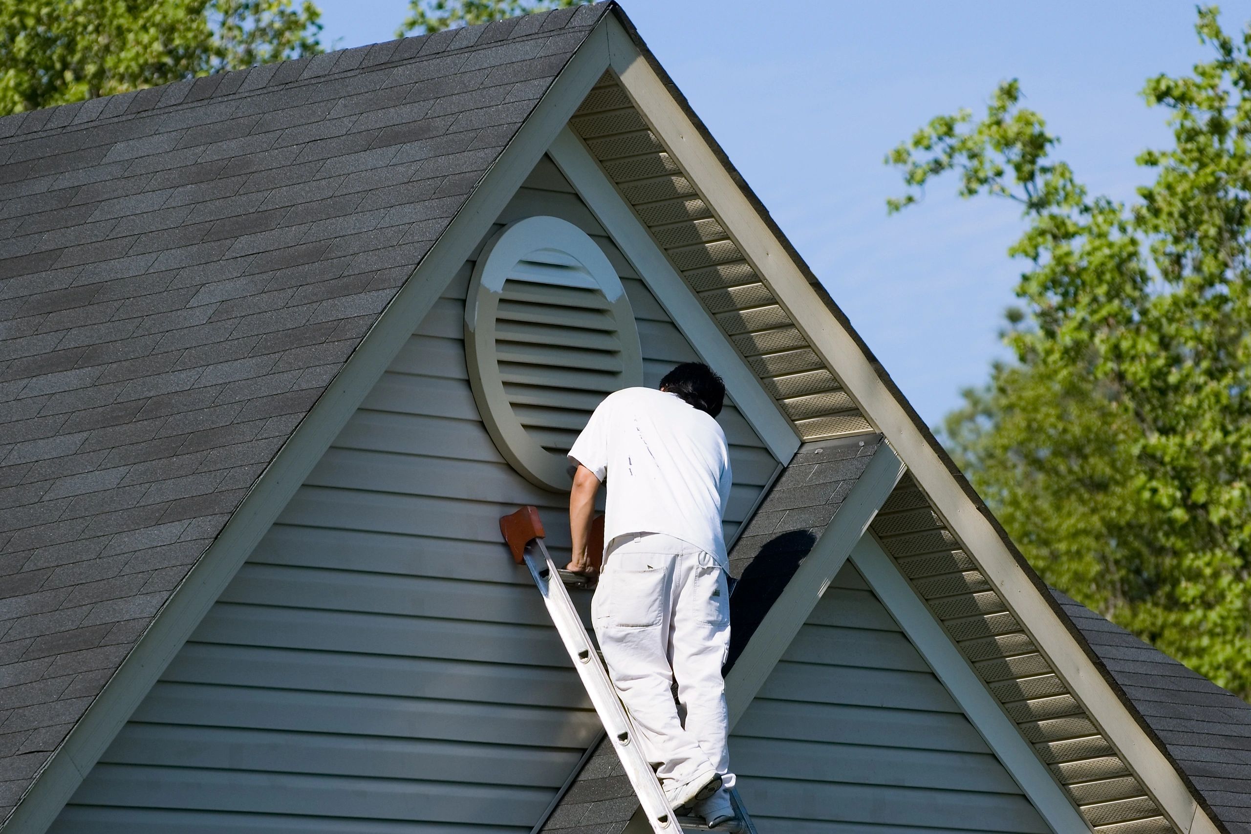 Byron Painting Co team painting a residential exterior in Barrie, Ontario